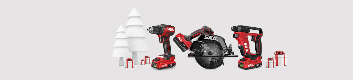 A selection of SKIL power tools surrounded by holiday gifts with a stylized white tree in the background