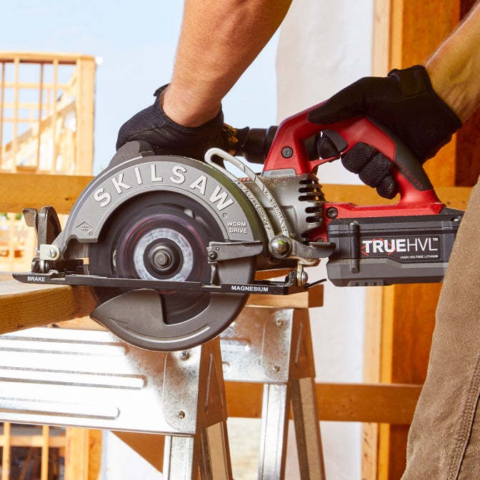 Man using a cordless Worm Drive saw powered by TRUE HVL™