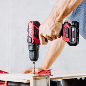 Man using a PWR CORE 12™ drill