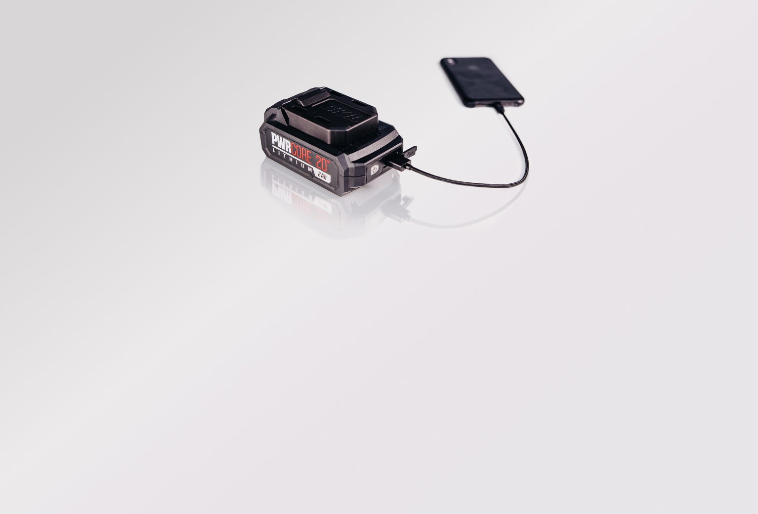 PWR CORE 20™ battery charging a cell phone