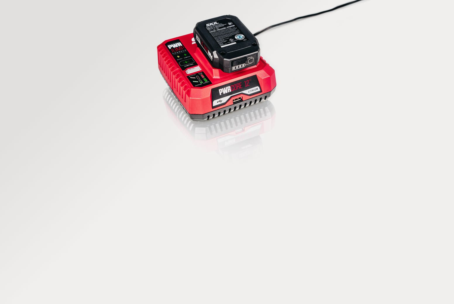 PWR CORE 12™ battery on a charger with PWR JUMP™ technology