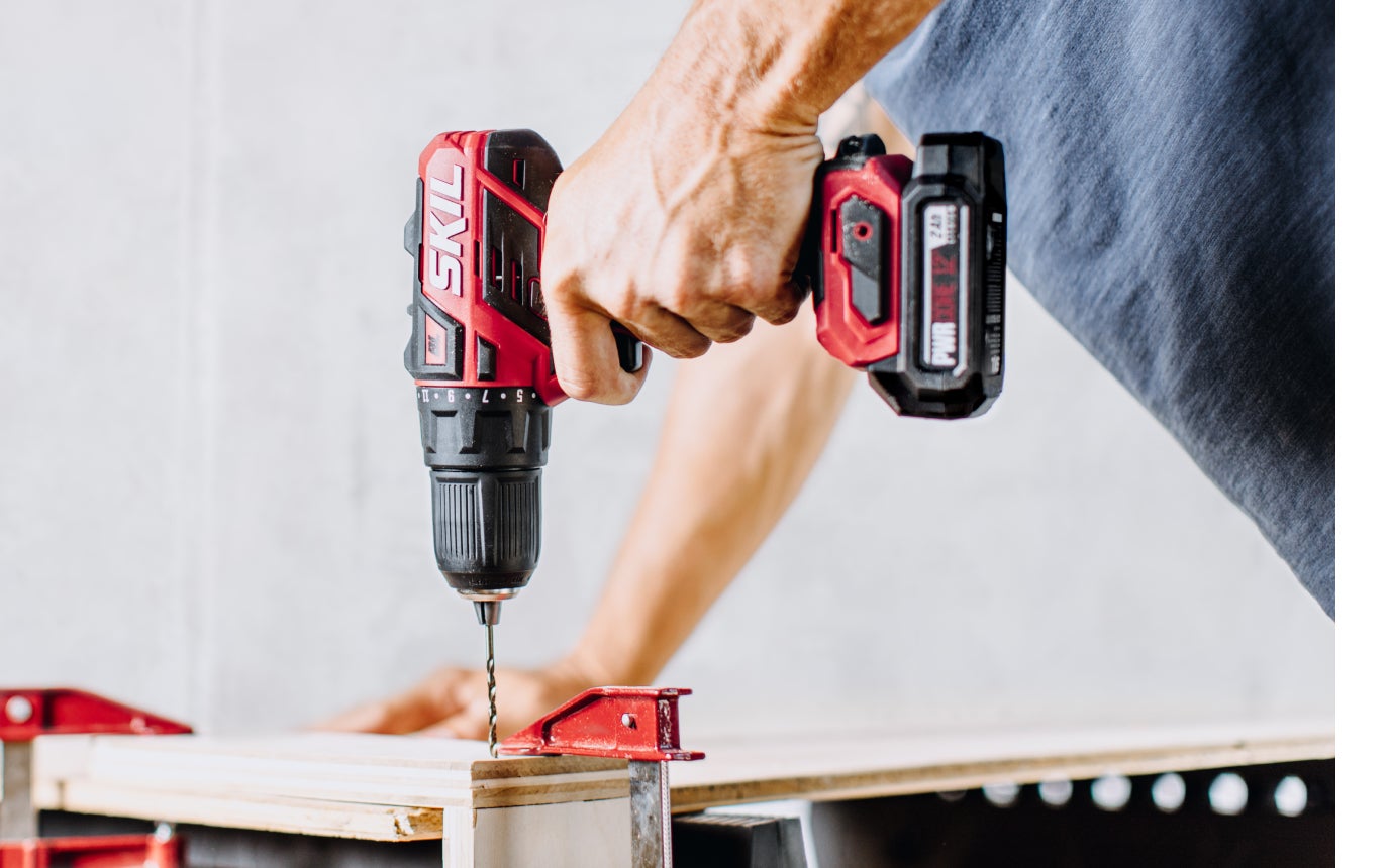 Man using a PWR CORE 12™ drill